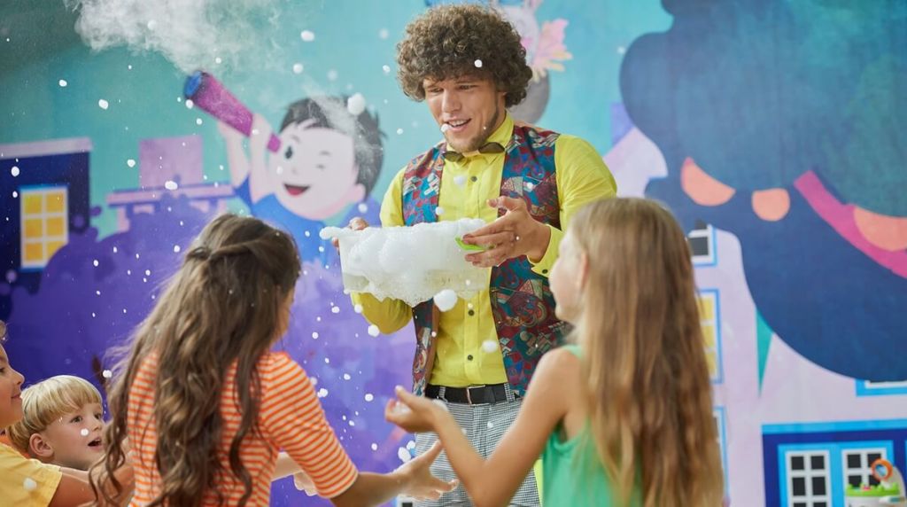 Entertainer at a childrens party making shapes out of foam