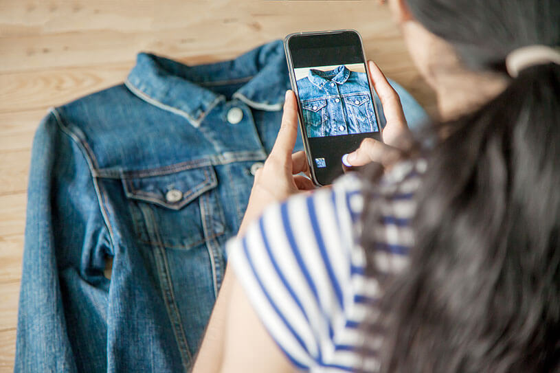 A small business owner takes product photography on their phone