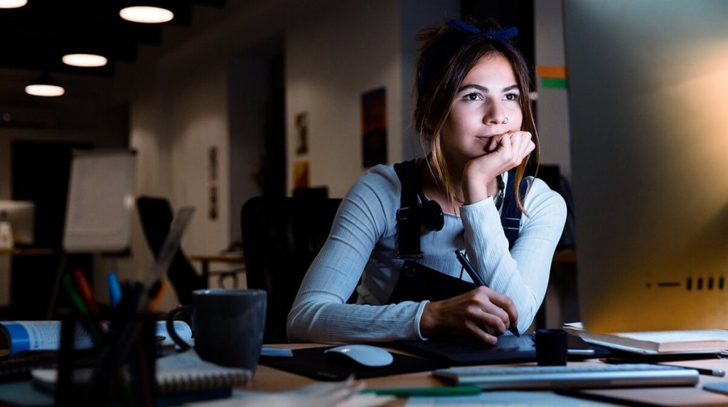 Web designer looking at computer